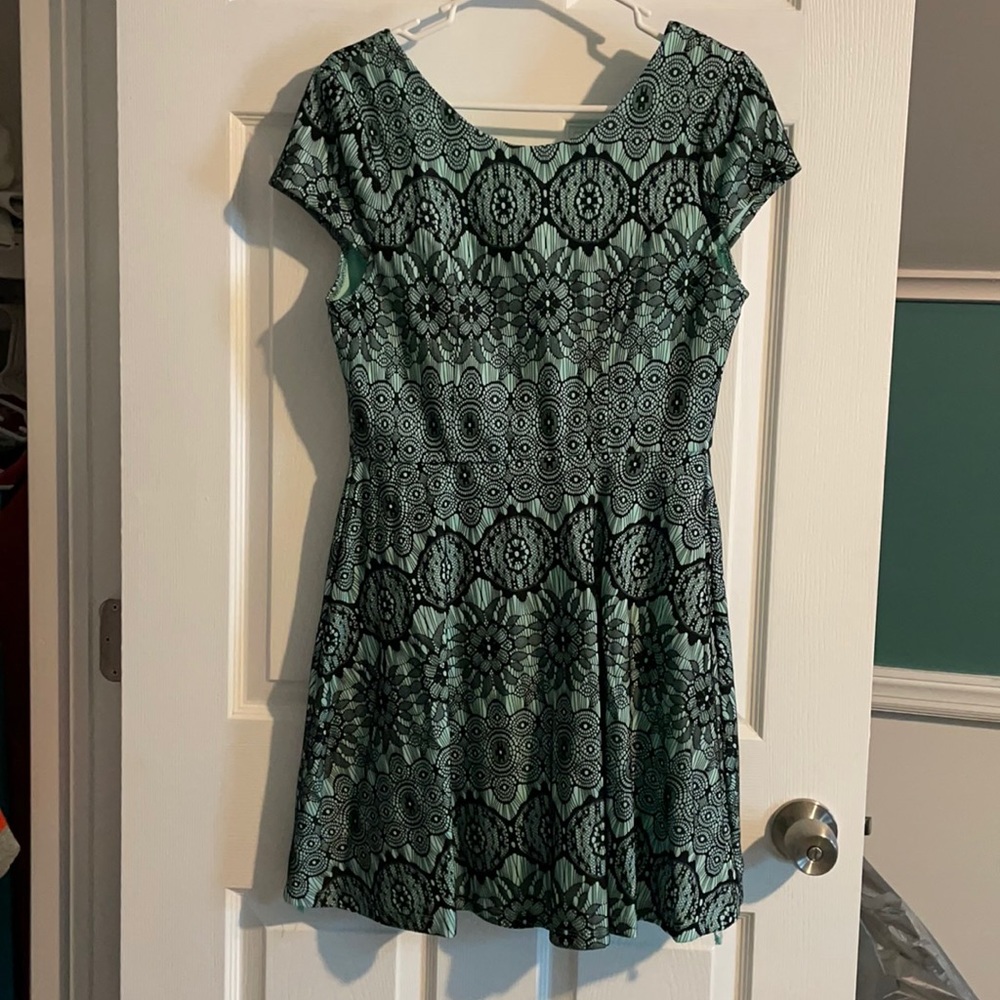 Mint and black shirtsleeve cocktail dress.